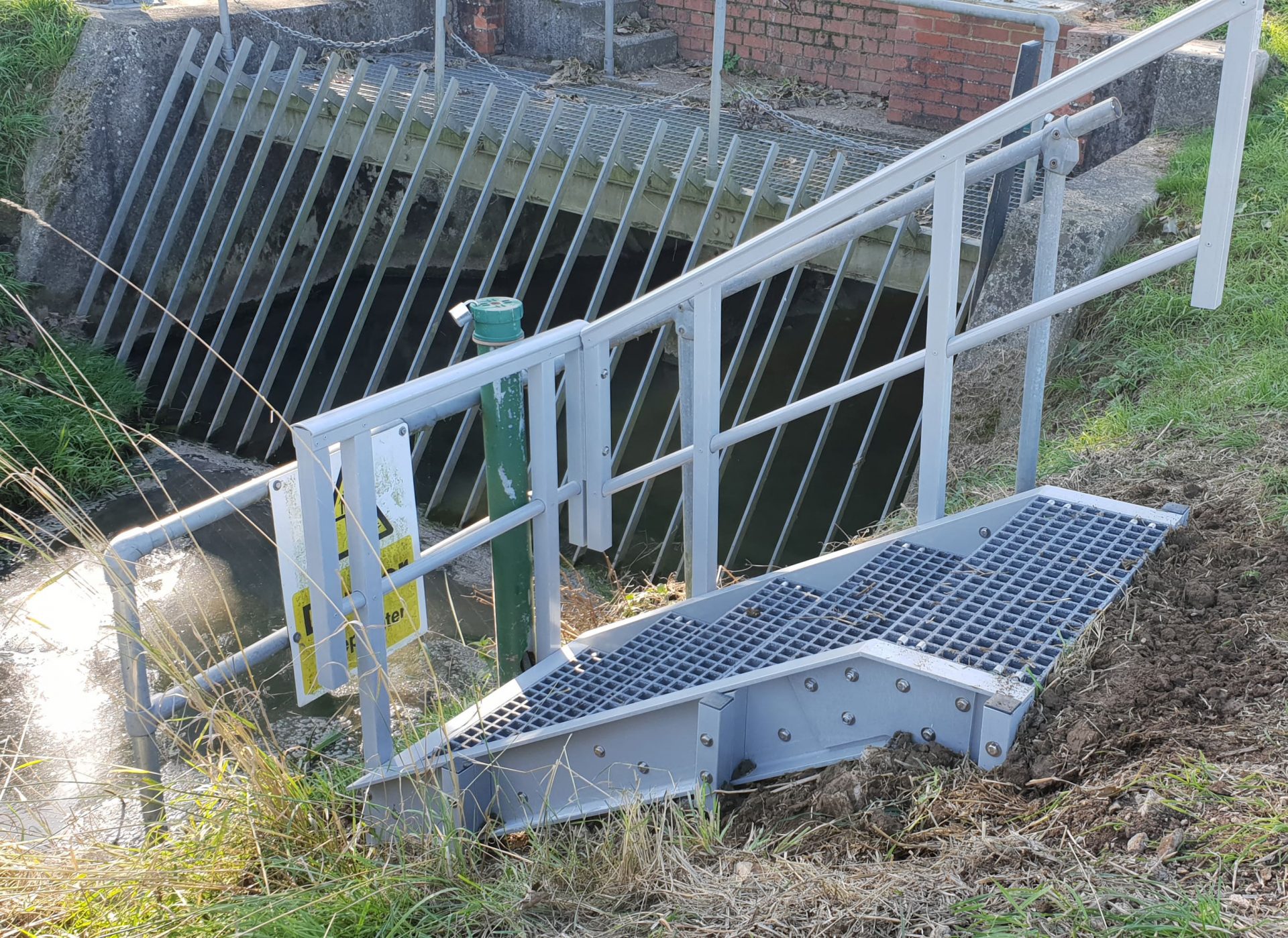 EA drainage ditch level monitoring GRP access steps with guardrail