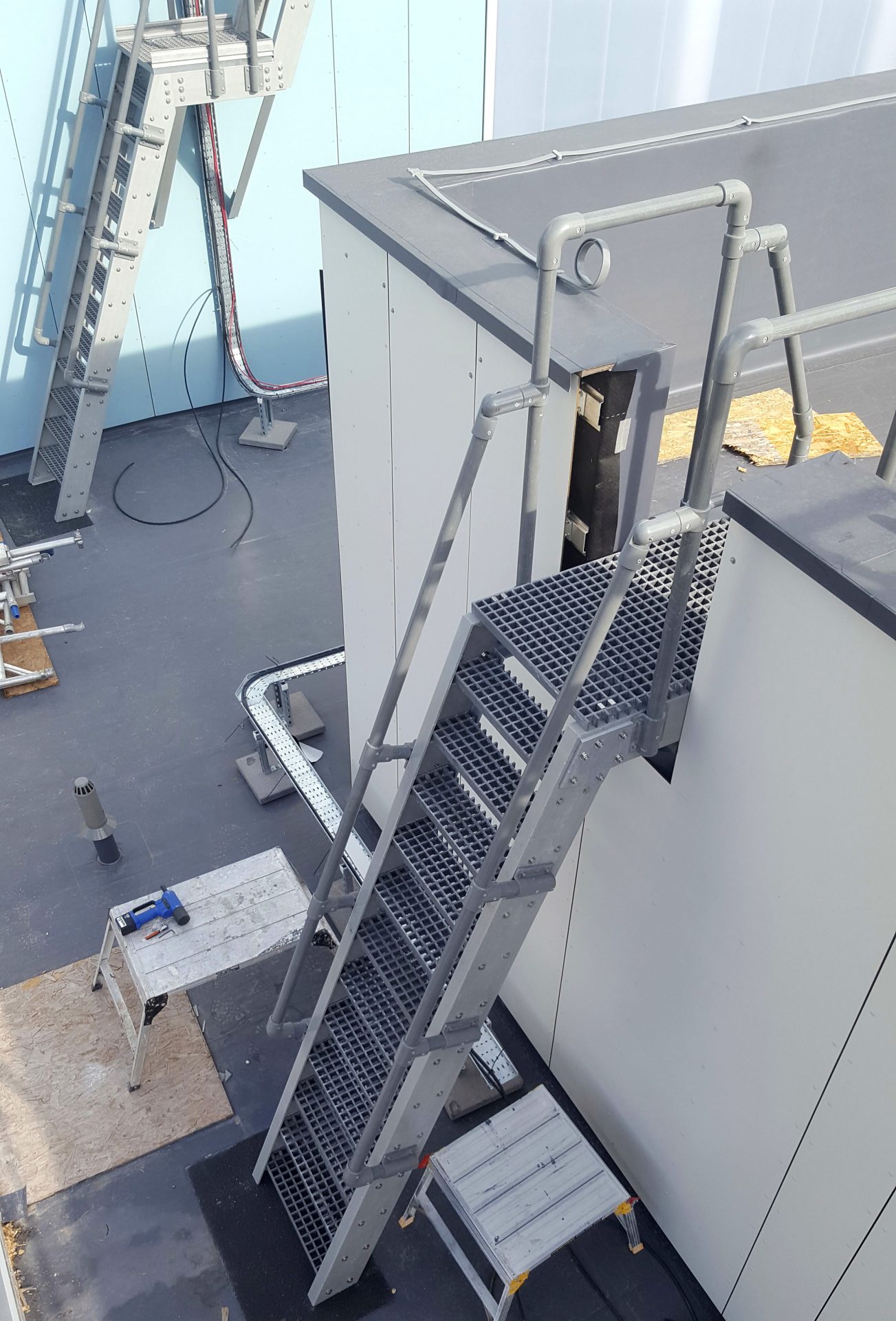 GRP Glass fibre fixed roof access ladders during installation