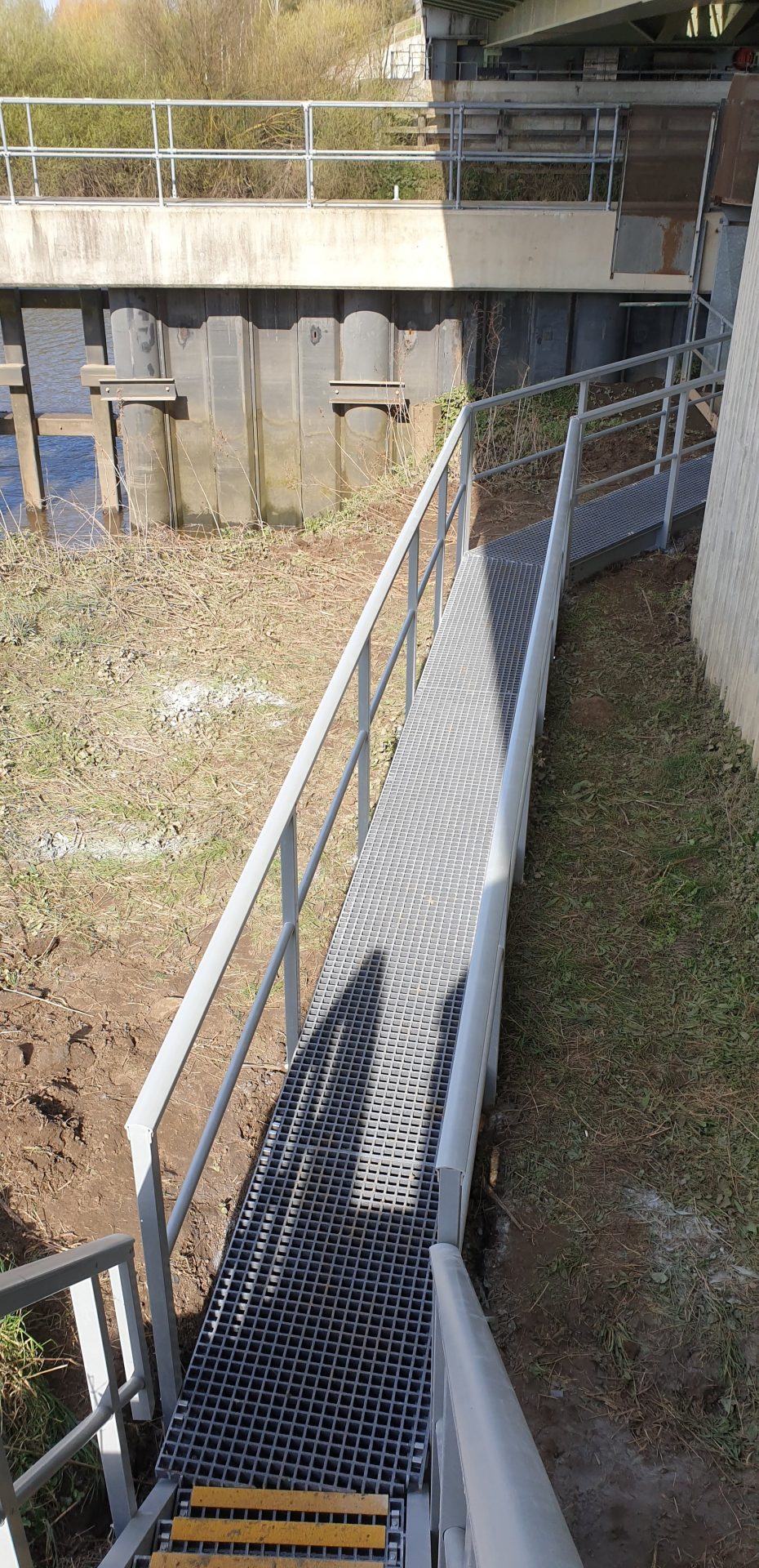 GRP raised access walkway with guardrail road bridge maintenence access aerial view
