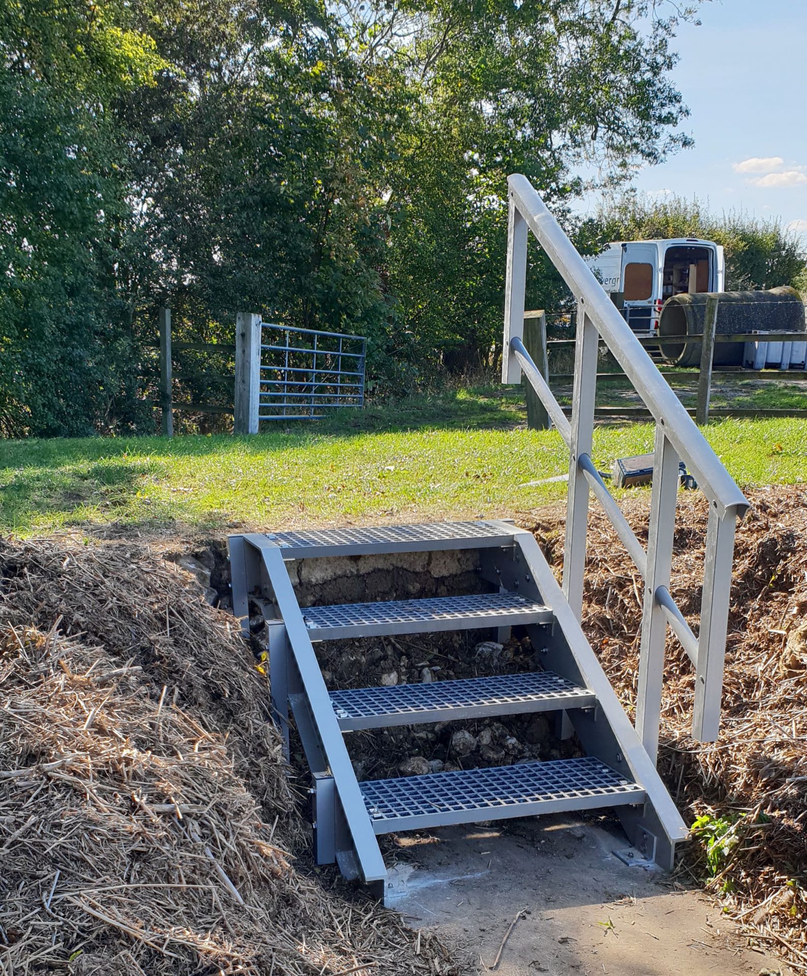 GRP short embankment steps with safety handrail